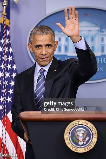 President Barack Obama waves goodbye at the conclusion of a news conference in the Brady Press Briefing Room at the White House December 16, 2016 in...