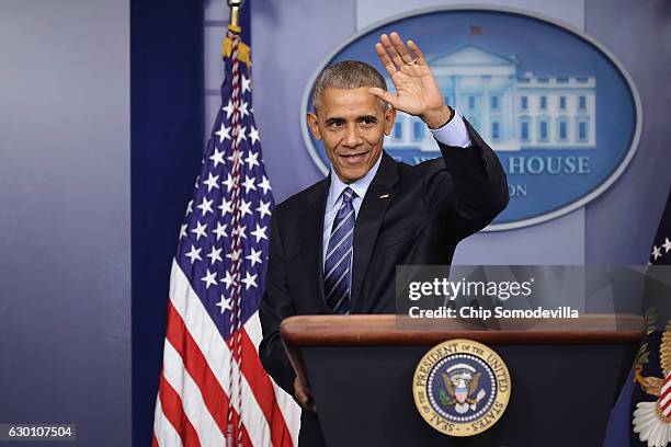 President Barack Obama waves goodbye at the conclusion of a news conference in the Brady Press Briefing Room at the White House December 16, 2016 in...