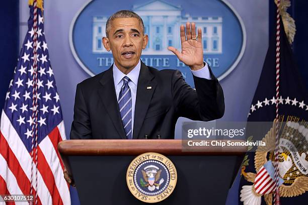 President Barack Obama waves goodbye at the conclusion of a news conference in the Brady Press Briefing Room at the White House December 16, 2016 in...