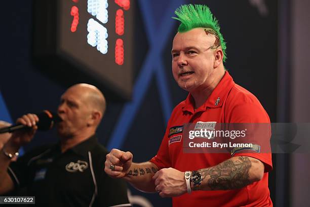 Peter Wright of Great Britain reacts to winning his game against Jerry Hendriks of The Netherlands on day two of the 2017 William Hill PDC World...