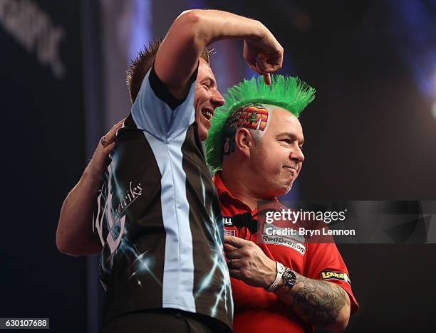 Peter Wright of Great Britain reacts to winning his game against Jerry Hendriks of The Netherlands on day two of the 2017 William Hill PDC World...