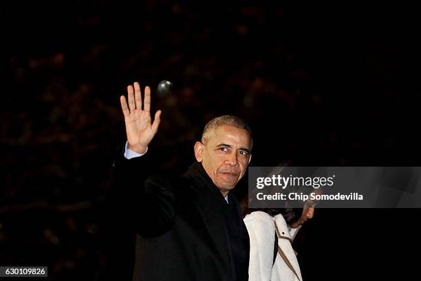 President Barack Obama and his daughter Sasha depart the White House before boarding Marine One on the South Lawn December 16, 2016 in Washington,...