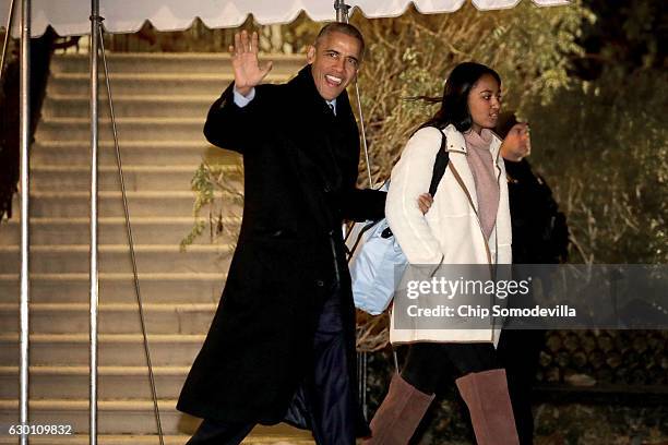 President Barack Obama and his daughter Sasha depart the White House before boarding Marine One on the South Lawn December 16, 2016 in Washington,...