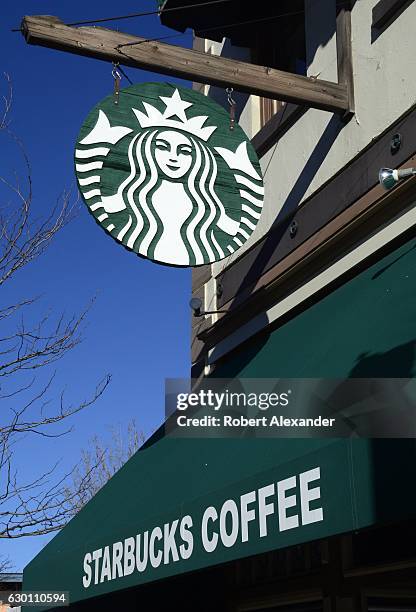 November 18, 2016: A sign with the Starbucks Coffee logo hangs over the entrance to a Starbucks shop in Durango, Colorado.