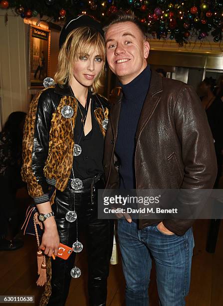 Edie Campbell and Alasdair McLellan attend the LOVE Christmas Party hosted by Katie Grand and Poppy Delevingne at George on December 16, 2016 in...