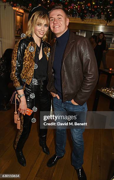 Edie Campbell and Alasdair McLellan attend the LOVE Christmas Party hosted by Katie Grand and Poppy Delevingne at George on December 16, 2016 in...