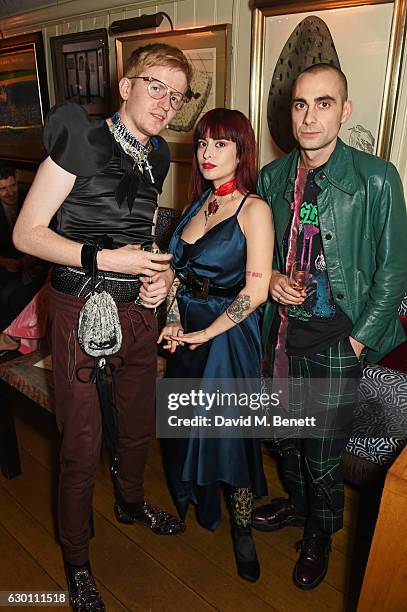 Ed Marler, Dilara Findikoglu and Harley Almond attend the LOVE Christmas Party hosted by Katie Grand and Poppy Delevingne at George on December 16,...