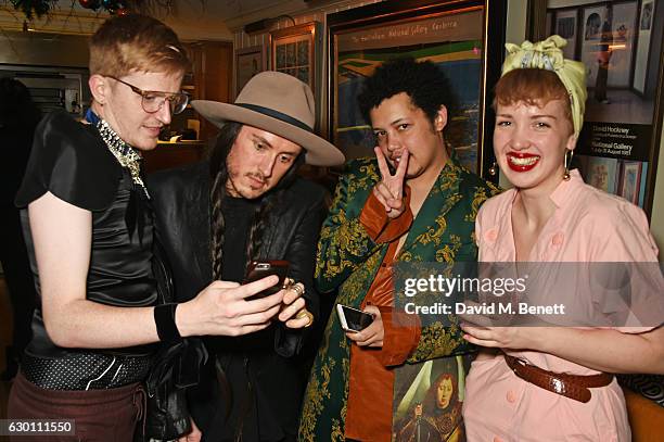 Ed Marler, Rob Meyers, Matthew Josephs and Kristy Noble attend the LOVE Christmas Party hosted by Katie Grand and Poppy Delevingne at George on...