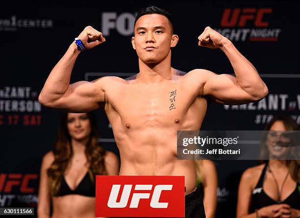 James Moontasri poses on the scale during the UFC Fight Night weigh-in inside the Golden 1 Center Arena on December 16, 2016 in Sacramento,...