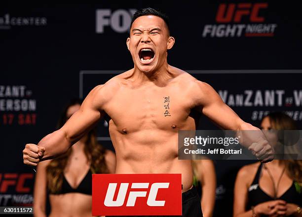 James Moontasri poses on the scale during the UFC Fight Night weigh-in inside the Golden 1 Center Arena on December 16, 2016 in Sacramento,...