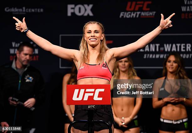 Paige VanZant poses on the scale during the UFC Fight Night weigh-in inside the Golden 1 Center Arena on December 16, 2016 in Sacramento, California.