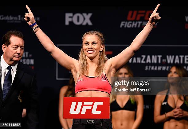 Paige VanZant poses on the scale during the UFC Fight Night weigh-in inside the Golden 1 Center Arena on December 16, 2016 in Sacramento, California.