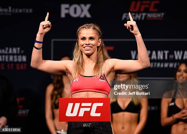 Paige VanZant poses on the scale during the UFC Fight Night weigh-in inside the Golden 1 Center Arena on December 16, 2016 in Sacramento, California.