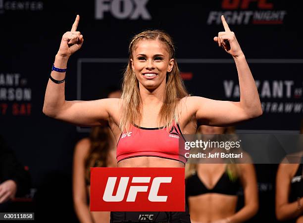 Paige VanZant poses on the scale during the UFC Fight Night weigh-in inside the Golden 1 Center Arena on December 16, 2016 in Sacramento, California.
