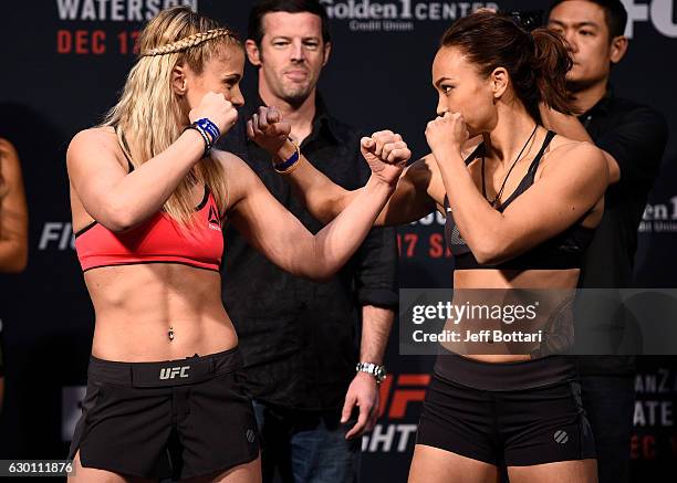 Paige VanZant and Michelle Waterson face off during the UFC Fight Night weigh-in inside the Golden 1 Center Arena on December 16, 2016 in Sacramento,...