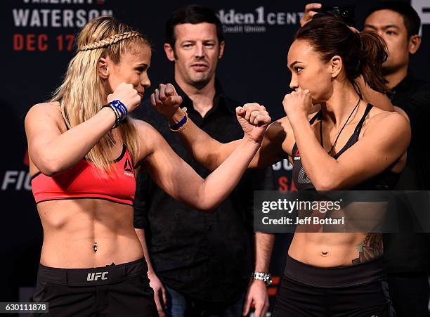 Paige VanZant and Michelle Waterson face off during the UFC Fight Night weigh-in inside the Golden 1 Center Arena on December 16, 2016 in Sacramento,...