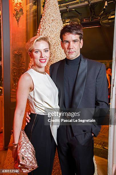 Scarlett Johansson and Romain Dauriac attend the Yummy Pop Grand Opening Party at Theatre du Gymnase on December 16, 2016 in Paris, France.