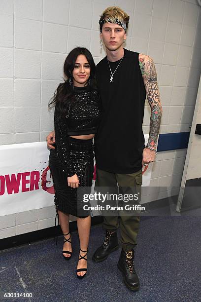 Camila Cabello and Machine Gun Kelly pose backstage at Power 96.1's Jingle Ball 2016 at Philips Arena on December 16, 2016 in Atlanta, Georgia.