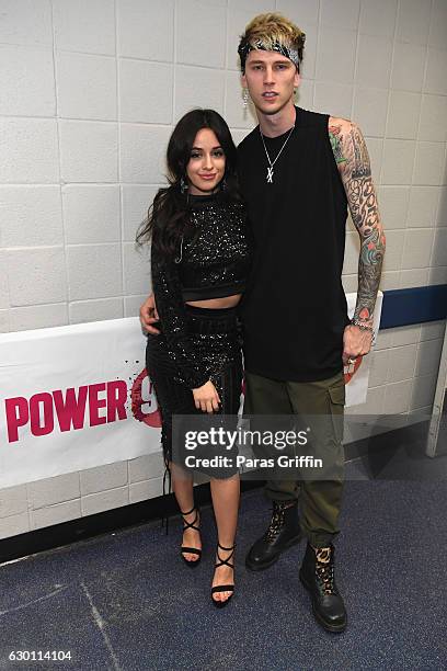 Camila Cabello and Machine Gun Kelly pose backstage at Power 96.1's Jingle Ball 2016 at Philips Arena on December 16, 2016 in Atlanta, Georgia.