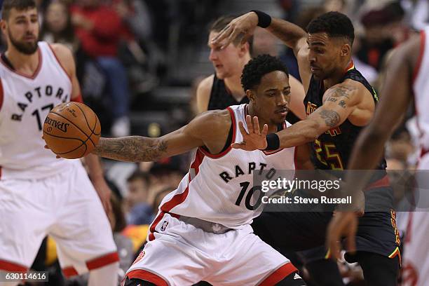 Toronto Raptors guard DeMar DeRozan is defended by Atlanta Hawks forward Thabo Sefolosha as the Toronto Raptors play the Atlanta Hawks at the Air...