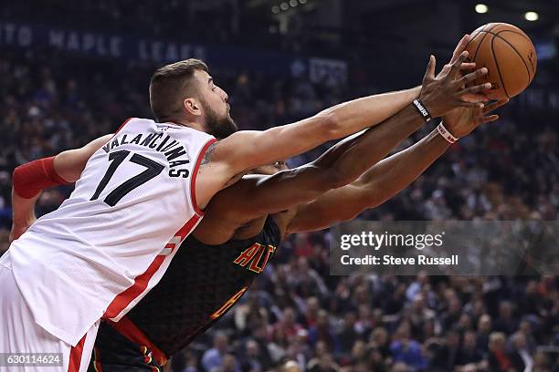 Toronto Raptors center Jonas Valanciunas knocks the ball away from Atlanta Hawks center Dwight Howard as the Toronto Raptors play the Atlanta Hawks...