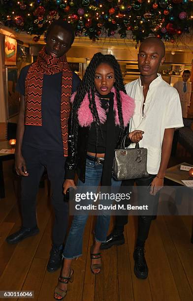 Wilson Oryema, Zaina Miuccia and Maximilian Davis attend the LOVE Christmas Party hosted by Katie Grand and Poppy Delevingne at George on December...