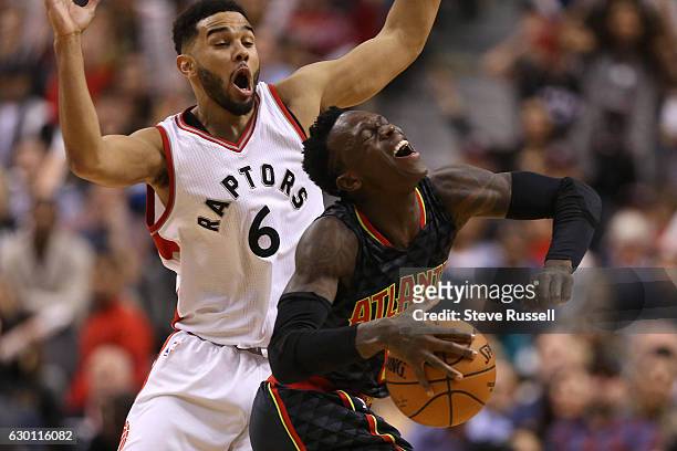 Toronto Raptors guard Cory Joseph fouls Atlanta Hawks guard Dennis Schroder in the closing seconds of the game as the Toronto Raptors lose to the...