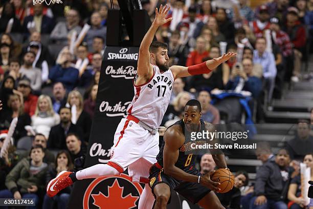 Toronto Raptors center Jonas Valanciunas defends against Atlanta Hawks center Dwight Howard as the Toronto Raptors lose to the Atlanta Hawks 125-121...
