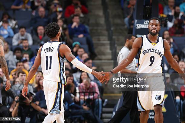 Mike Conley and Tony Allen of the Memphis Grizzlies celebrate during a game against the Sacramento Kings on December 16, 2016 at FedExForum in...