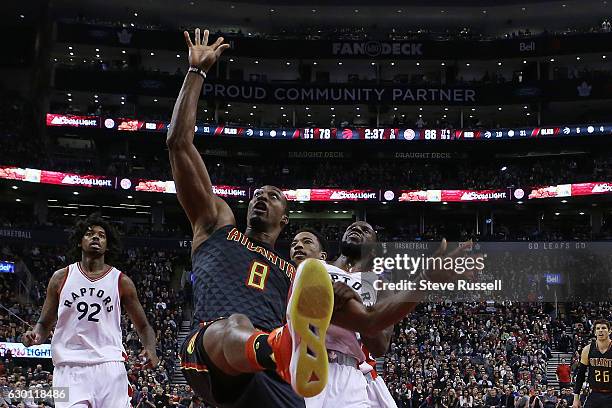 Atlanta Hawks center Dwight Howard is fouled by DeMar DeRozan and DeMarre Carroll as the Toronto Raptors lose to the Atlanta Hawks 125-121 at the Air...