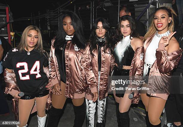 Ally Brooke, Normani Hamilton, Camila Cabello, Lauren Jauregui, and Dinah Jane Hansen of Fifth Harmony pose backstage during Power 96.1's Jingle Ball...