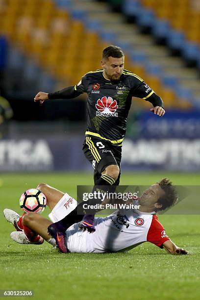 Kosta Barbarrouses of Wellington is tackled by Aritz Borda of Western Sydney during the round 11 A-League match between Wellington and Western Sydney...