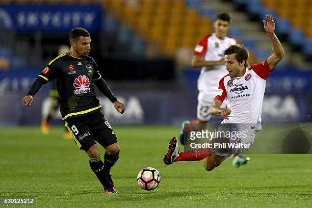 Kosta Barbarrouses of Wellington is tackled by Aritz Borda of Western Sydney during the round 11 A-League match between Wellington and Western Sydney...