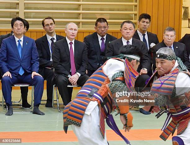 Russian President Vladimir Putin , a well-known judo enthusiast, watches a performance by two men in armor, together with Japanese Prime Minister...