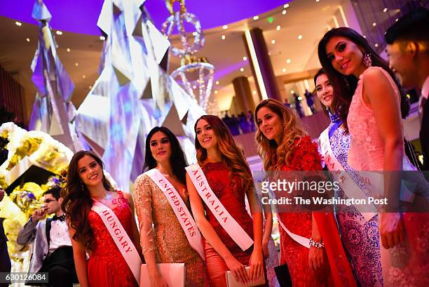 Miss World Contestants mingle at the grand opening party for the MGM Casino in the National Harbor on December 8, 2016.