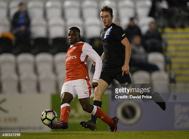 Eddie Nketiah of Arsenal passes the ball under pressure from Charley Doyle of Blackburn during the Premier League match between Arsenal and Stoke...