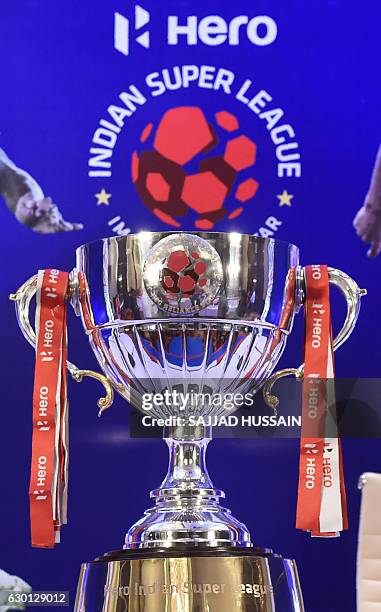 The Indian Super League trophy stands before a pre-match press conference in Kochi on December 17 ahead of the ISL final between Kerala Blasters FC...