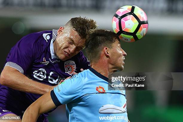 Shane Lowry of the Glory and Filip Holosko of Sydney contest a header during the round 11 A-League match between Perth Glory and Sydney FC at nib...