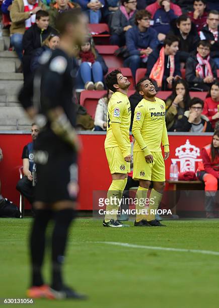 Villarreal's Mexican forward Jonathan dos Santos celebrates with teammate Brazilian forward Alexandre Pato after scoring a goal during the Spanish...