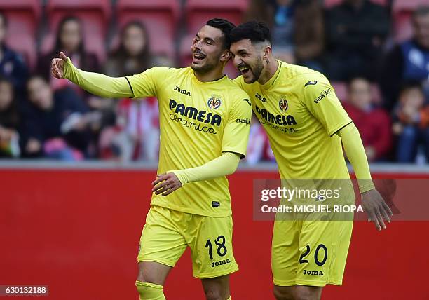 Villarreal's Italian forward Nicola Sansone celebrates with teammate Italian forward Roberto Soriano after scoring a goal during the Spanish league...