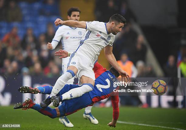 Gary Cahill of Chelsea and Joel Ward of Crystal Palace both battle to win a header during the Premier League match between Crystal Palace and Chelsea...