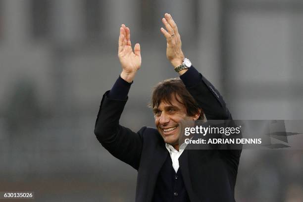 Chelsea's Italian head coach Antonio Conte applauds the fans following the English Premier League football match between Crystal Palace and Chelsea...