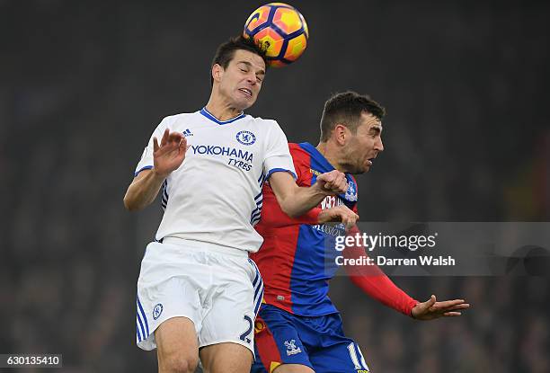 Cesar Azpilicueta of Chelsea and James McArthur of Crystal Palace battle to win a header during the Premier League match between Crystal Palace and...
