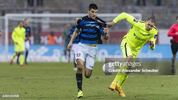 Cagatay Kader of FSV Frankfurt challenges Steven Ruprecht of Wiesbaden during the Third League match between FSV Frankfurt and Wehen Wiesbaden at...