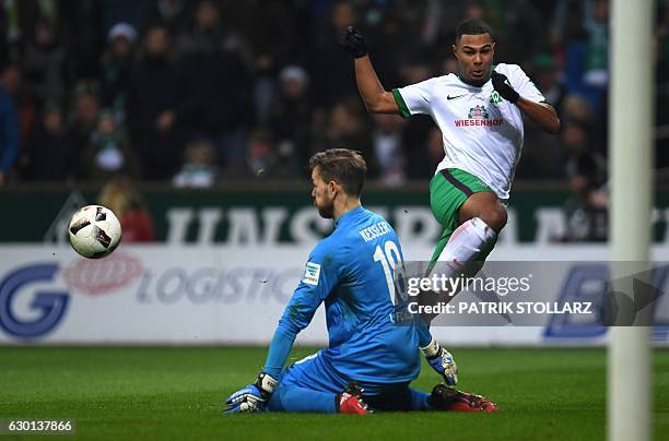 Cologne's goalkeeper Thomas Kessler save the attempt by Bremen's midfielder Serge Gnabry during the German first division Bundesliga football match...