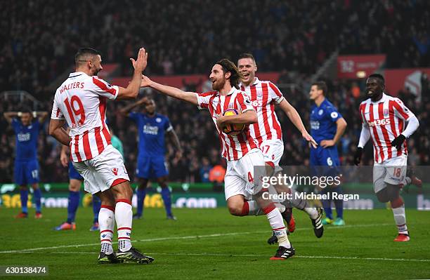Joe Allen of Stoke City celebrates scoring his sides second goal with Jonathan Walters of Stoke City during the Premier League match between Stoke...