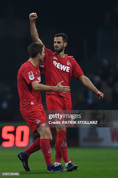 Cologne's defender Dominique Heintz and Cologne's Alabanian defender Mergim Mavraj celebrate during the German first division Bundesliga football...