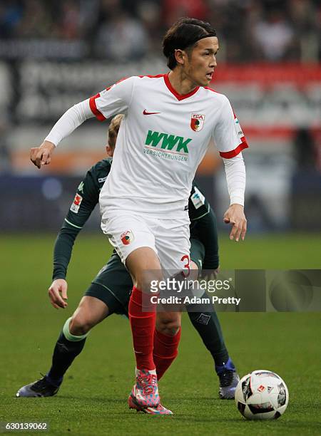 Takashi Usami of Augsburg in action during the Bundesliga match between FC Augsburg and Borussia Moenchengladbach at WWK Arena on December 17, 2016...