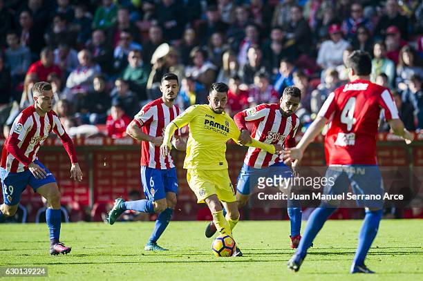 Nicola Sansone of Villarreal CF duels for the ball with Douglas Pereira of Real Sporting de Gijon during the La Liga match between Real Sporting de...