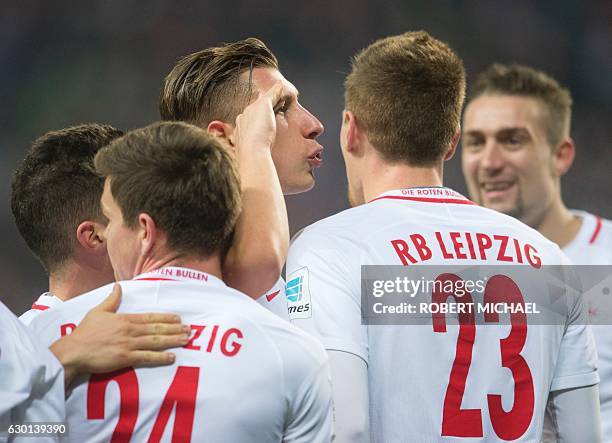 Leipzig´s defender Willi Orban celebrates with his teamate after scoring during the German first division Bundesliga football match between RB...